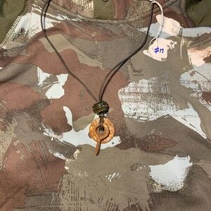 Industrial hardware necklace with a glass bead